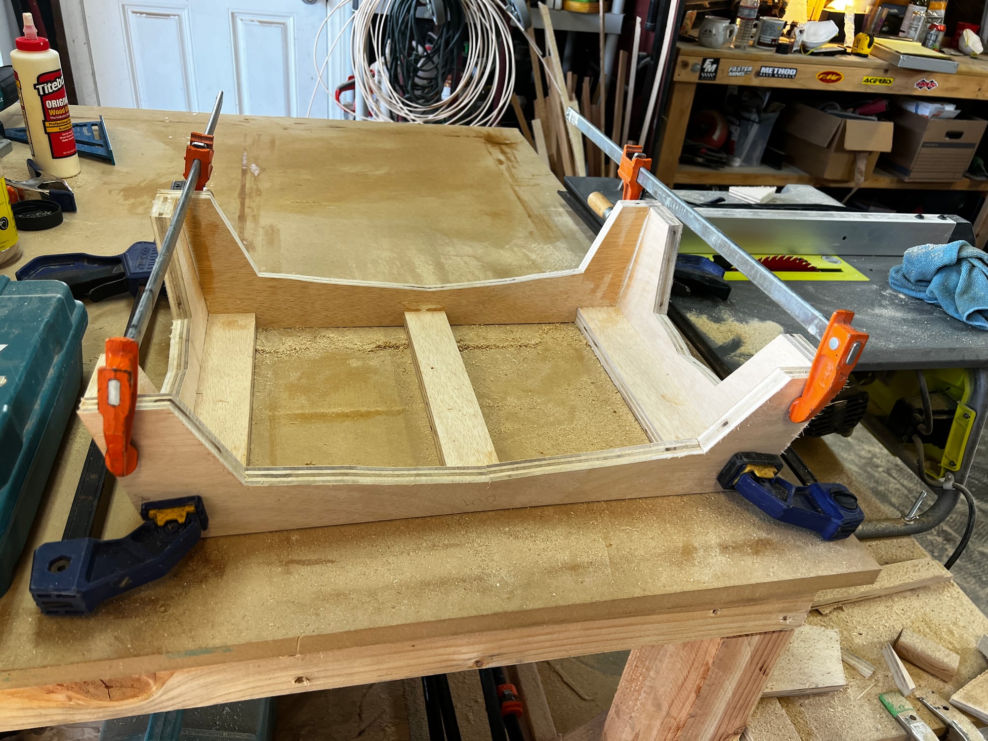 Custom curved cabinet base under construction
