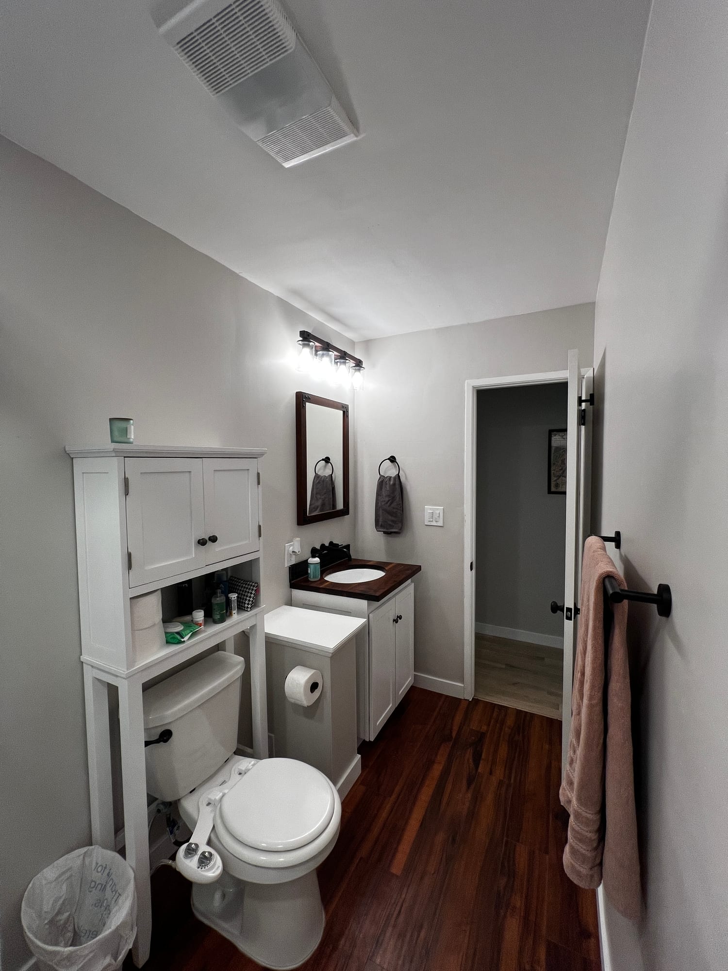 Remodeled bathroom with vanity and storage